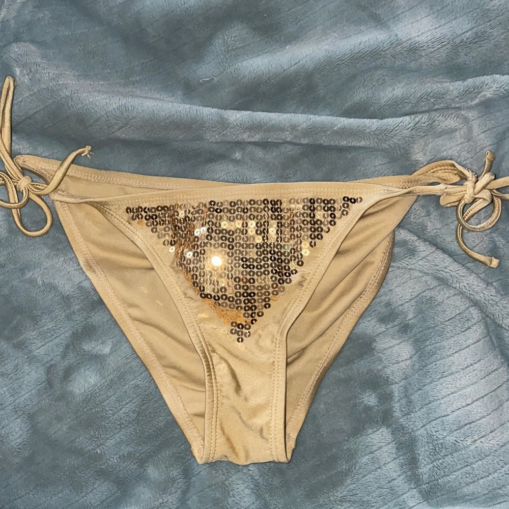 Gold bikini bottom with sequins.  Never worn. No tags